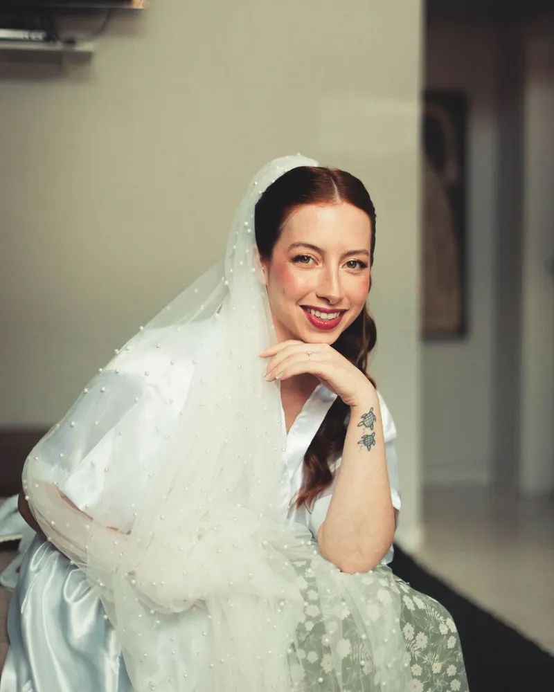 Happy bride in her veil, ready for the ceremony